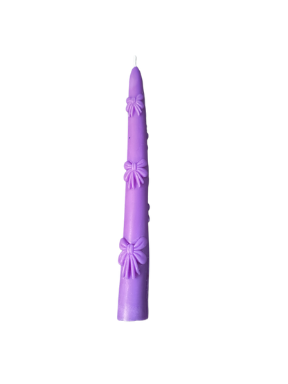 Bow tapered candle